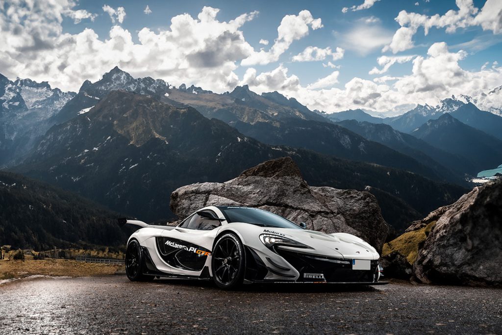 McLaren P1 GTR in a dramatic mountain setting, embodying raw power and exclusive engineering for true car enthusiasts.